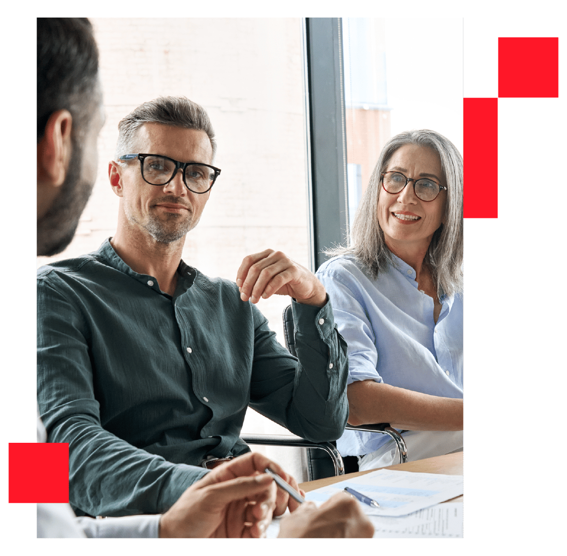 Male and female board executives talking in a meeting