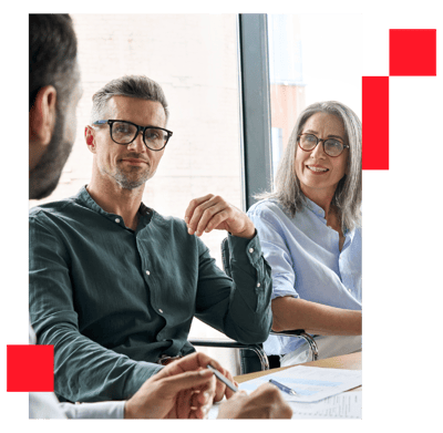 Male and female board executives talking in a meeting